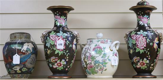 A pair of Staffordshire pottery vases decorated peonies and butterflies on a black ground, with rams head handles and two other items